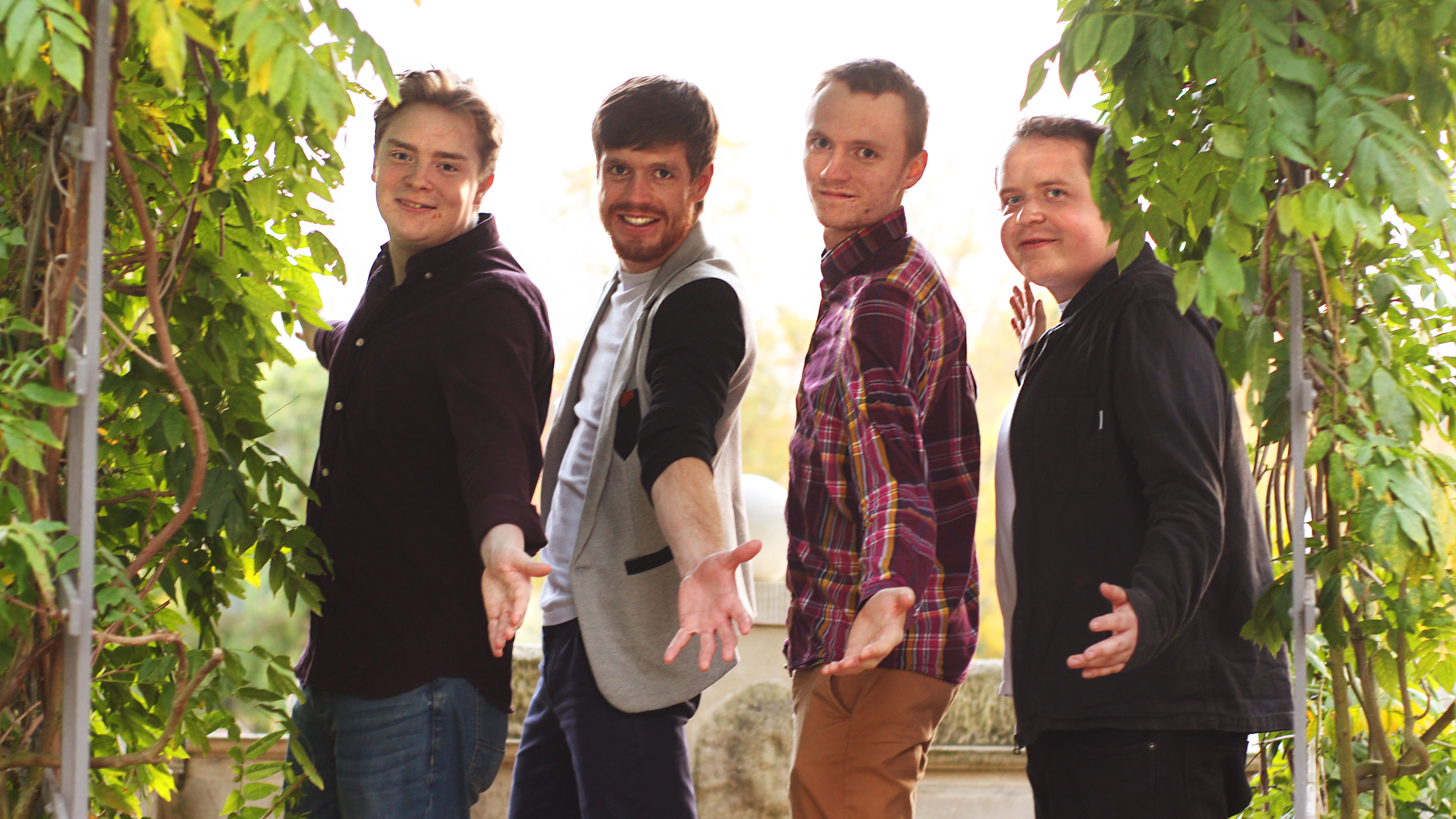 On That Note quartet reaching out under a garden arch